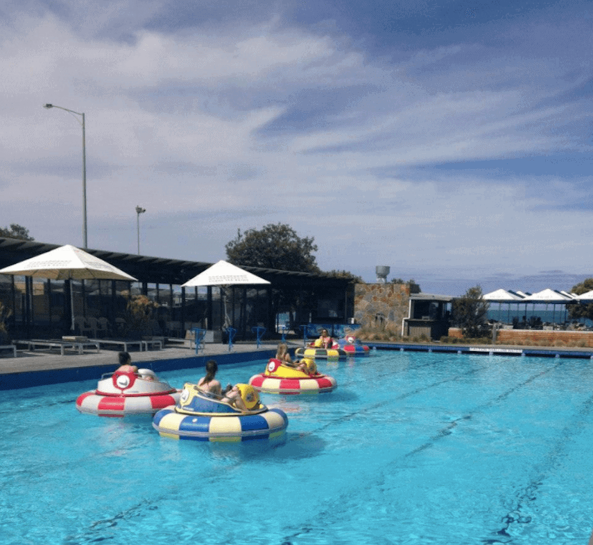 Swimming pool with three bumper boats at Lorne Sea Baths