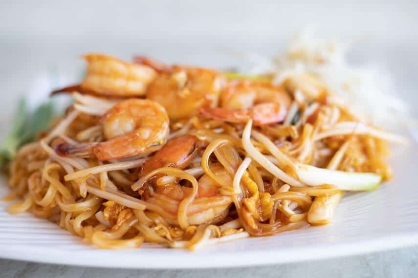 Plate of Thai noodles with prawns and bean shoots