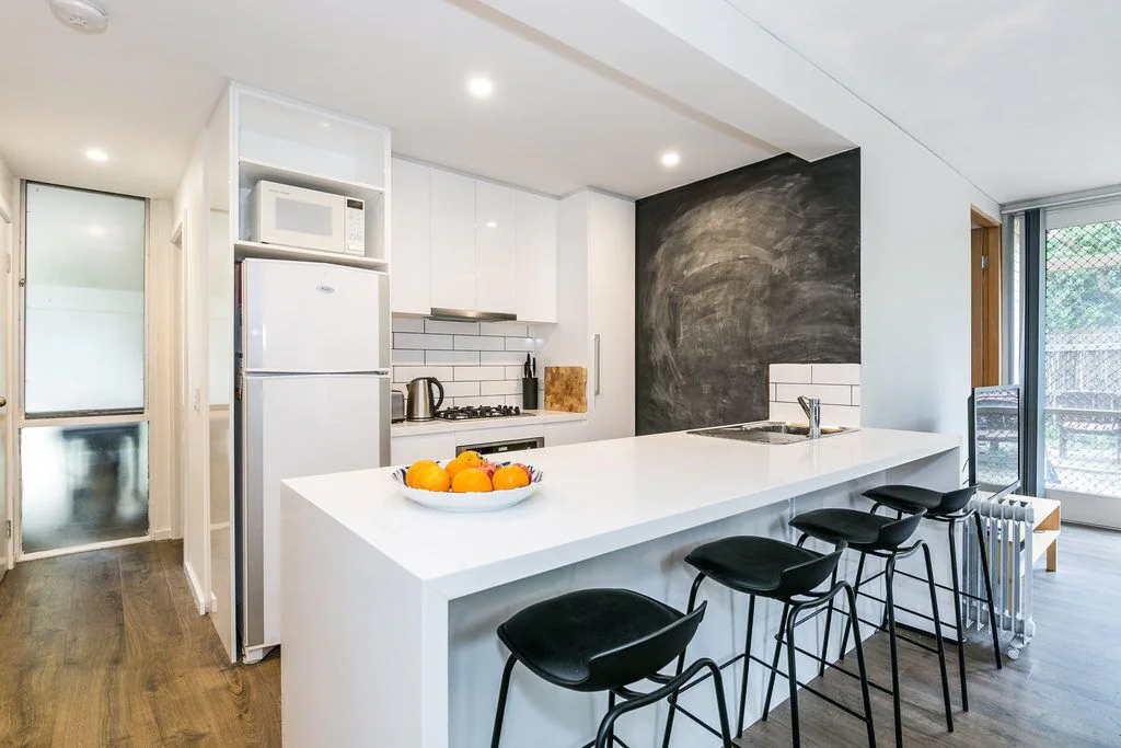 Cosy Corner Kitchen with white Island bench